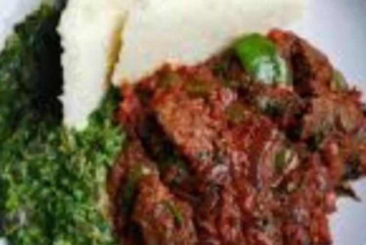 Goat meat fried with managu and ugali